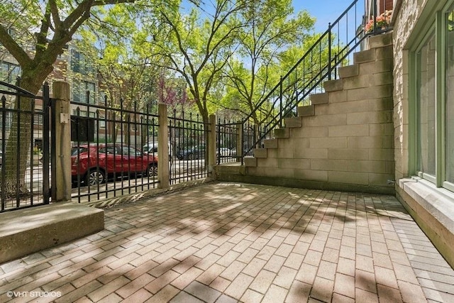 gate featuring fence and stairway