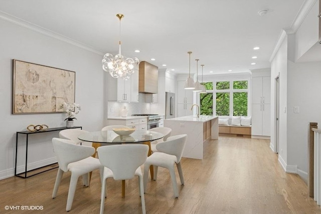 dining space with crown molding, light wood finished floors, recessed lighting, baseboards, and a chandelier