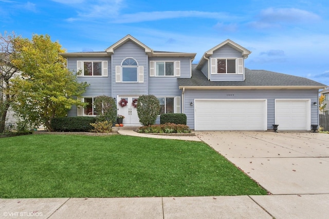 1449 Mesa Dr, Bolingbrook, IL 60490 - view of front of house with a garage, a front lawn, and concrete driveway