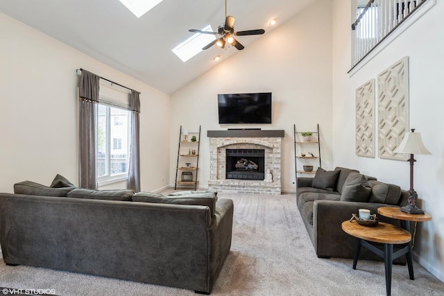1449 Mesa Dr, Bolingbrook, IL 60490 - carpeted living area featuring high vaulted ceiling, a skylight, baseboards, a ceiling fan, and a fireplace