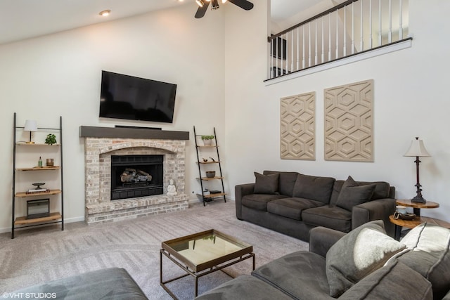 1449 Mesa Dr, Bolingbrook, IL 60490 - carpeted living area featuring ceiling fan, baseboards, a fireplace, and a high ceiling