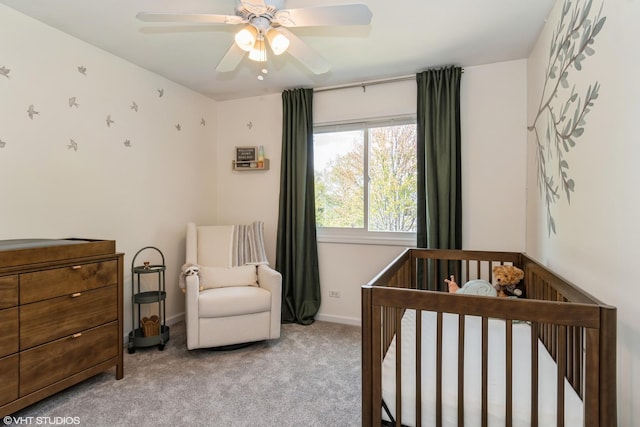 1449 Mesa Dr, Bolingbrook, IL 60490 - bedroom featuring light colored carpet, a nursery area, baseboards, and a ceiling fan