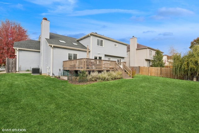 1449 Mesa Dr, Bolingbrook, IL 60490 - back of house with a wooden deck, a chimney, central AC unit, and a shingled roof