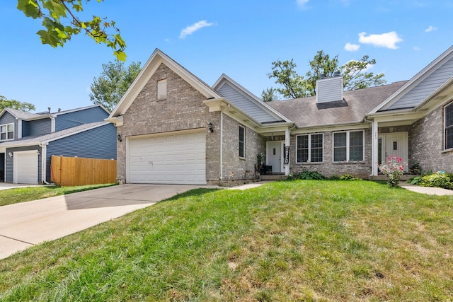 260-262 Chaparral Cir, Elgin, IL 60120 - view of front facade featuring brick siding, a chimney, driveway, and an attached garage
