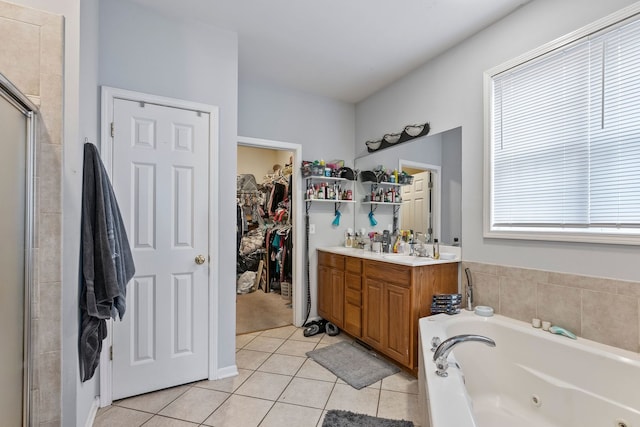 260-262 Chaparral Cir, Elgin, IL 60120 - full bathroom featuring tile patterned floors, a whirlpool tub, a spacious closet, a stall shower, and double vanity