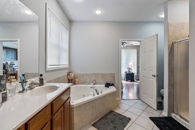260-262 Chaparral Cir, Elgin, IL 60120 - full bathroom featuring a stall shower, a tub with jets, tile patterned flooring, and vanity