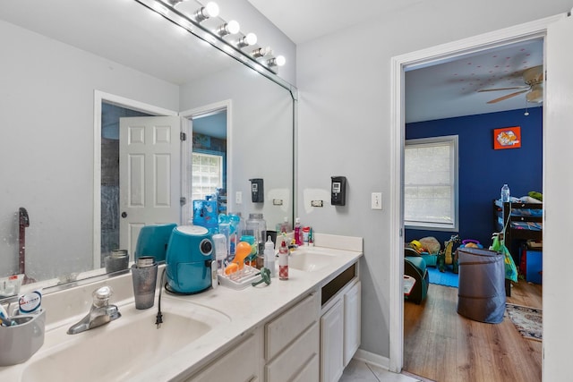 260-262 Chaparral Cir, Elgin, IL 60120 - bathroom featuring double vanity, healthy amount of natural light, ceiling fan, and wood finished floors