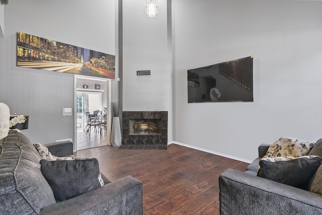 260-262 Chaparral Cir, Elgin, IL 60120 - living area with wood-type flooring, a high ceiling, and a tile fireplace