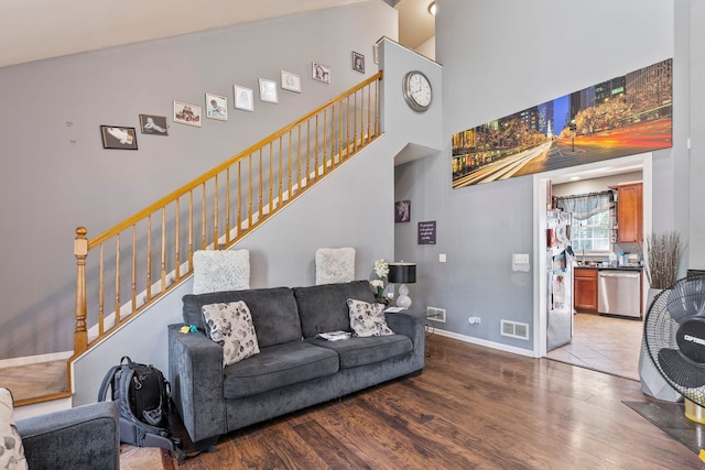 260-262 Chaparral Cir, Elgin, IL 60120 - living room featuring stairway, high vaulted ceiling, and wood finished floors