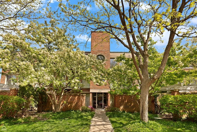 6040 Arbor Ln Unit 102, Northfield, IL 60093 - view of front facade featuring brick siding