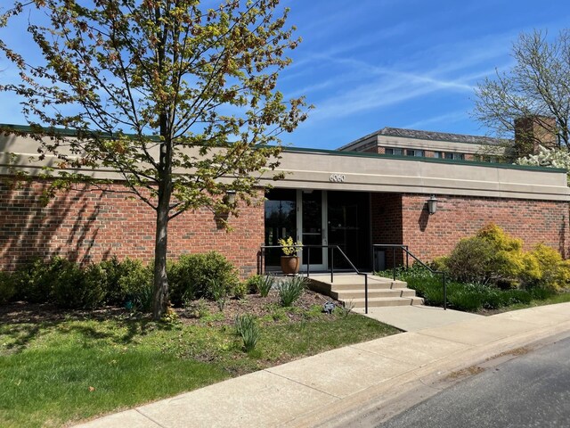 6040 Arbor Ln Unit 102, Northfield, IL 60093 - view of front of home featuring brick siding