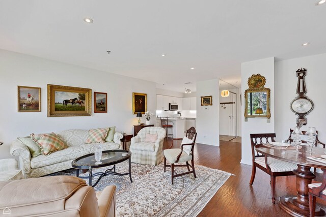 6040 Arbor Ln Unit 102, Northfield, IL 60093 - living area featuring dark wood-style floors and recessed lighting