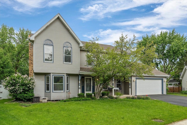 1545 London Ct, Naperville, IL 60563 - view of front of house featuring asphalt driveway, a garage, and roof with shingles