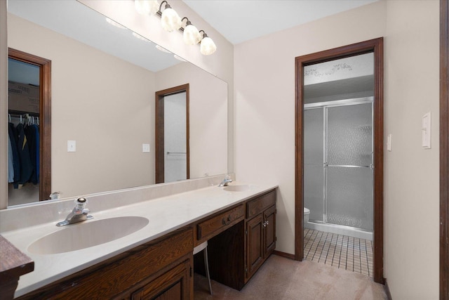 1545 London Ct, Naperville, IL 60563 - bathroom featuring double vanity, toilet, a stall shower, a spacious closet, and tile patterned floors