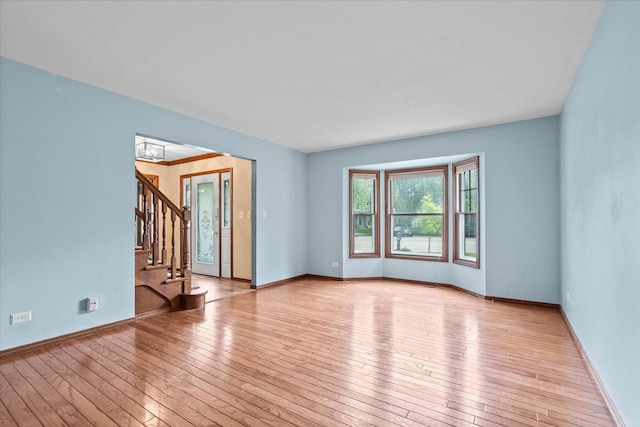 1545 London Ct, Naperville, IL 60563 - spare room with hardwood / wood-style flooring, stairway, and baseboards