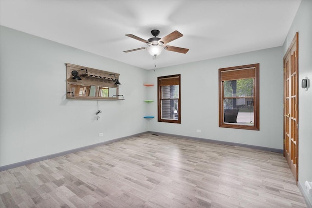 1545 London Ct, Naperville, IL 60563 - empty room with a ceiling fan, light wood finished floors, and baseboards
