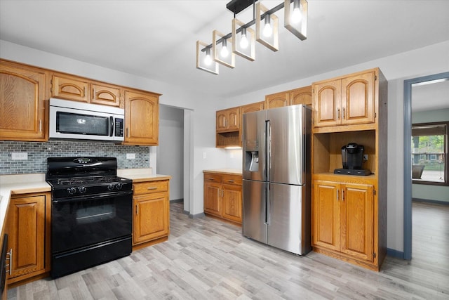1545 London Ct, Naperville, IL 60563 - kitchen featuring appliances with stainless steel finishes, light wood-type flooring, tasteful backsplash, and light countertops