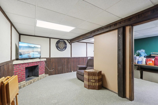 1771 Shoshonee Trl, Wheeling, IL 60090 - living area featuring carpet flooring, a paneled ceiling, wainscoting, wood walls, and a brick fireplace