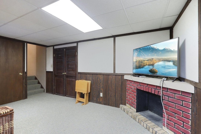 1771 Shoshonee Trl, Wheeling, IL 60090 - living room with a brick fireplace, carpet, a drop ceiling, wainscoting, and stairs