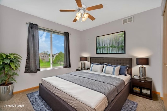 bedroom featuring carpet, baseboards, and ceiling fan