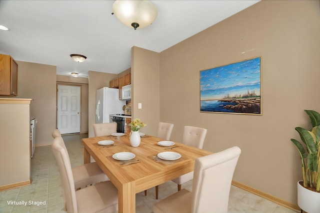 dining room with baseboards