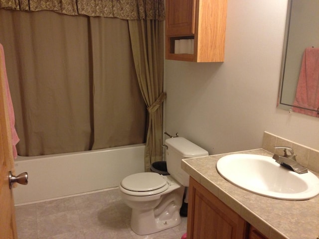 2210 E Michigan Ave, Urbana, IL 61802 - full bathroom featuring vanity, shower / bathtub combination with curtain, and toilet