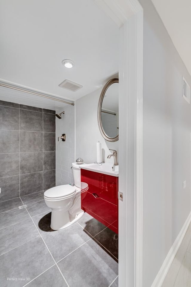 8724 S Jeffery Blvd, Chicago, IL 60617 - full bathroom featuring toilet, vanity, tile patterned flooring, and a tile shower