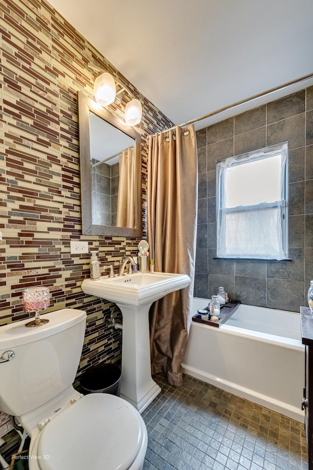8724 S Jeffery Blvd, Chicago, IL 60617 - bathroom featuring toilet, tile walls, and a sink