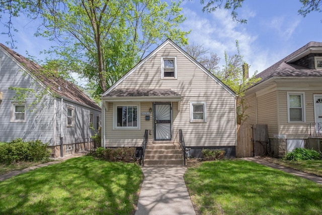 12435 S Perry Ave, Chicago, IL 60628 - view of front facade with a front yard