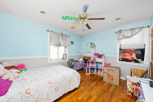 bedroom with wood finished floors and ceiling fan