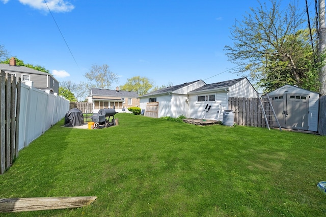 view of yard with a shed and an outbuilding