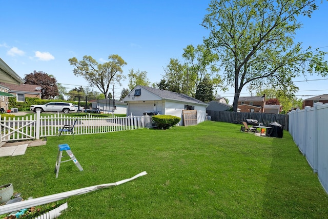 view of yard with a detached garage