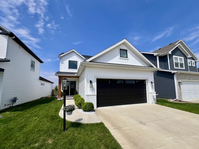 3133 Palmer Dr, Champaign, IL 61822 - view of front facade featuring board and batten siding, concrete driveway, a front lawn, and a garage