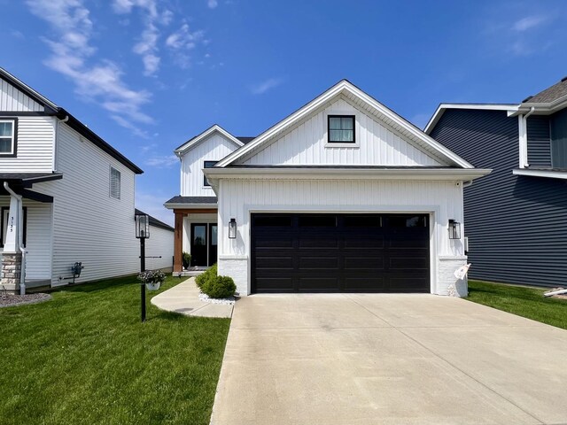 3133 Palmer Dr, Champaign, IL 61822 - modern farmhouse style home with an attached garage, driveway, a front lawn, and board and batten siding