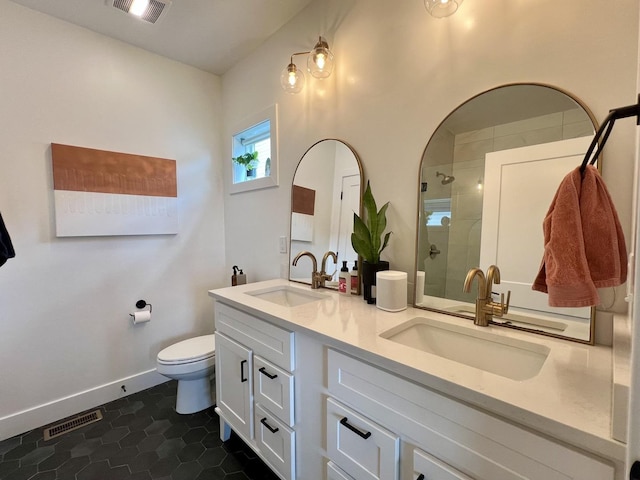 3133 Palmer Dr, Champaign, IL 61822 - bathroom with a tile shower, toilet, tile patterned flooring, double vanity, and baseboards