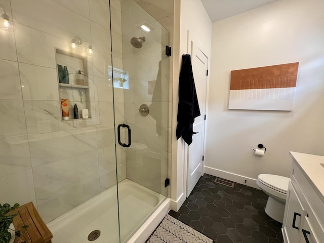 3133 Palmer Dr, Champaign, IL 61822 - bathroom with a shower stall, toilet, vanity, tile patterned floors, and baseboards