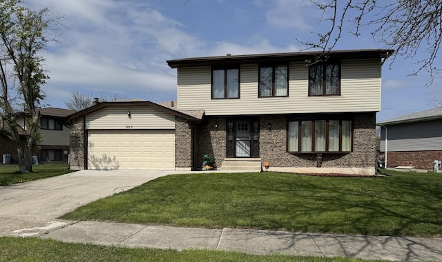 view of front of house featuring an attached garage, a front lawn, concrete driveway, and brick siding