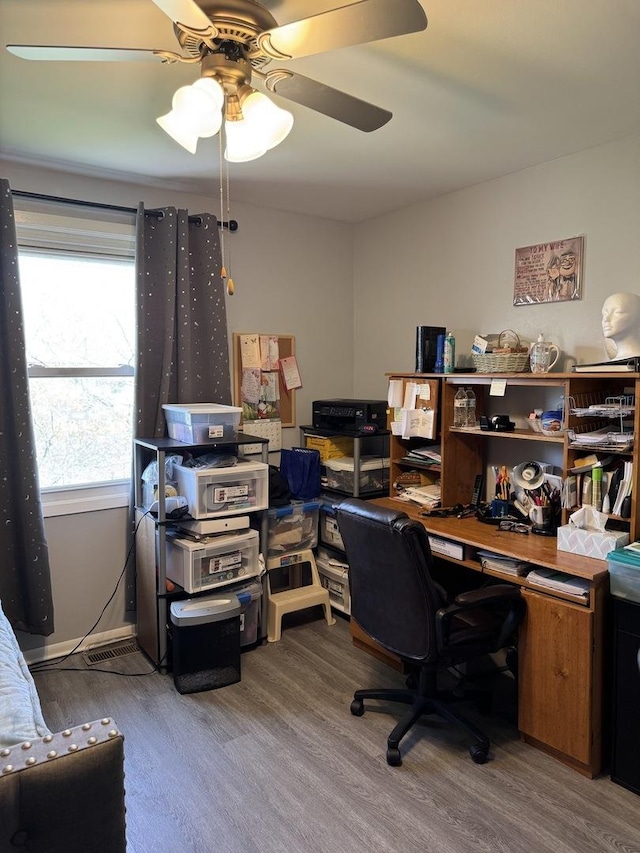 office space featuring wood finished floors and a ceiling fan
