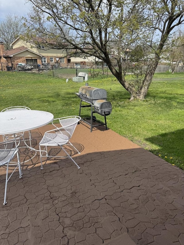view of patio featuring a grill