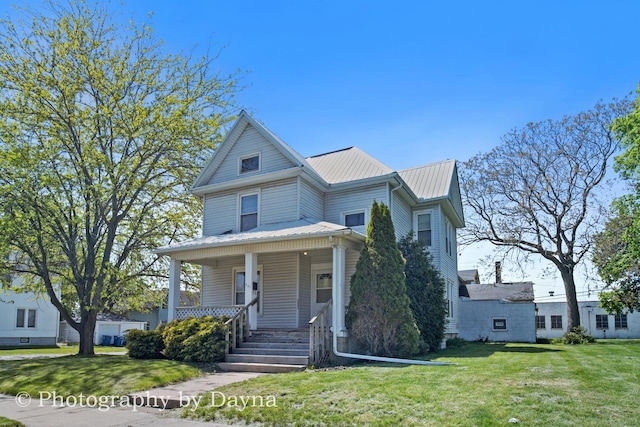 491 S Dearborn Ave, Kankakee, IL 60901 - view of front of home with covered porch, metal roof, and a front lawn