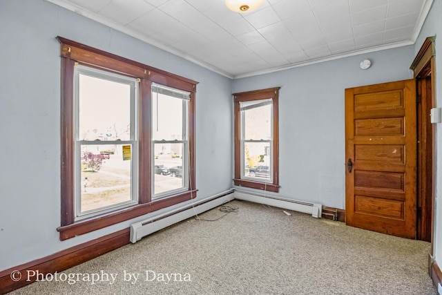 491 S Dearborn Ave, Kankakee, IL 60901 - carpeted empty room featuring a baseboard radiator, ornamental molding, and a smoke detector