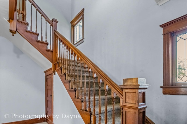491 S Dearborn Ave, Kankakee, IL 60901 - staircase featuring a towering ceiling and baseboards