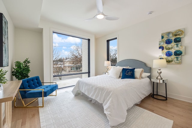 8115 E Prairie Rd, Skokie, IL 60076 - bedroom featuring wood finished floors, access to outside, ceiling fan, and baseboards