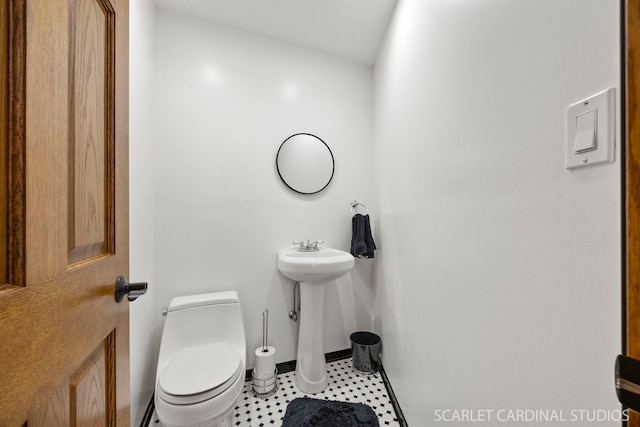 1045 S Grace St, Lombard, IL 60148 - bathroom with toilet, baseboards, and tile patterned flooring