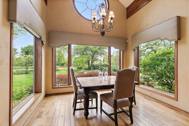 660 Plum Tree Dr, Barrington Hills, IL 60010 - dining room featuring a high ceiling, light wood-style floors, beam ceiling, and a chandelier