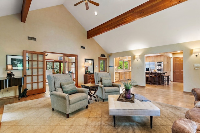 660 Plum Tree Dr, Barrington Hills, IL 60010 - living room featuring high vaulted ceiling, light wood-type flooring, ceiling fan, beam ceiling, and french doors