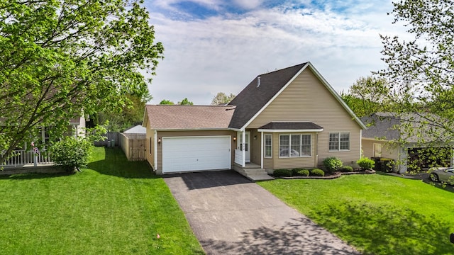 view of front of home with a garage, driveway, and a shingled roof