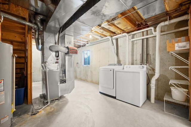 below grade area with water heater, washing machine and dryer, and heating unit