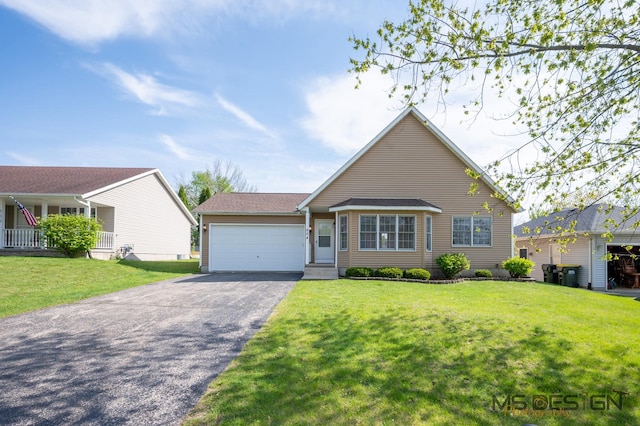 view of front of home featuring driveway, an attached garage, and a front yard