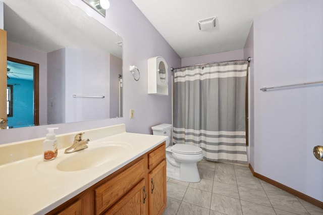 bathroom with toilet, vanity, and a shower with shower curtain